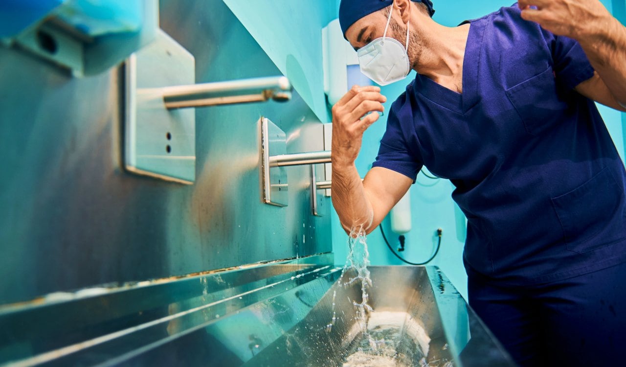 Surgeon Scrubbing In Before Surgery